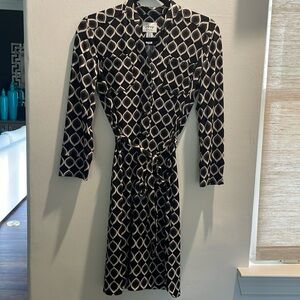 Black geometric work dress with double breast pockets and tie at natural waste